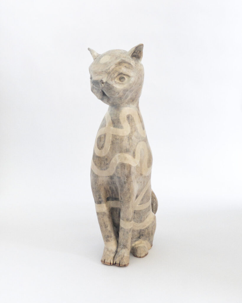 Ceramic cat glazed with a tangled swirly pattern in matte brown and beige glazes