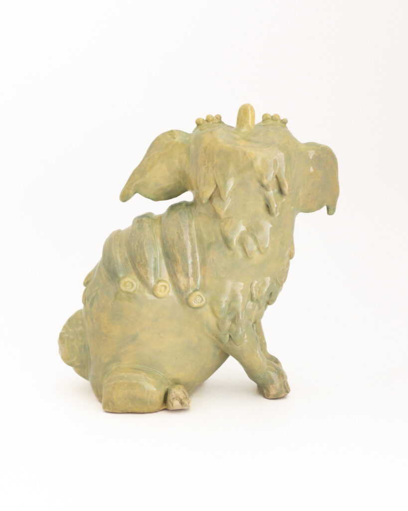 Ceramic sculpture based on Chinese-style dogs or lions in the Brighton pavilion, with green glaze, rear view