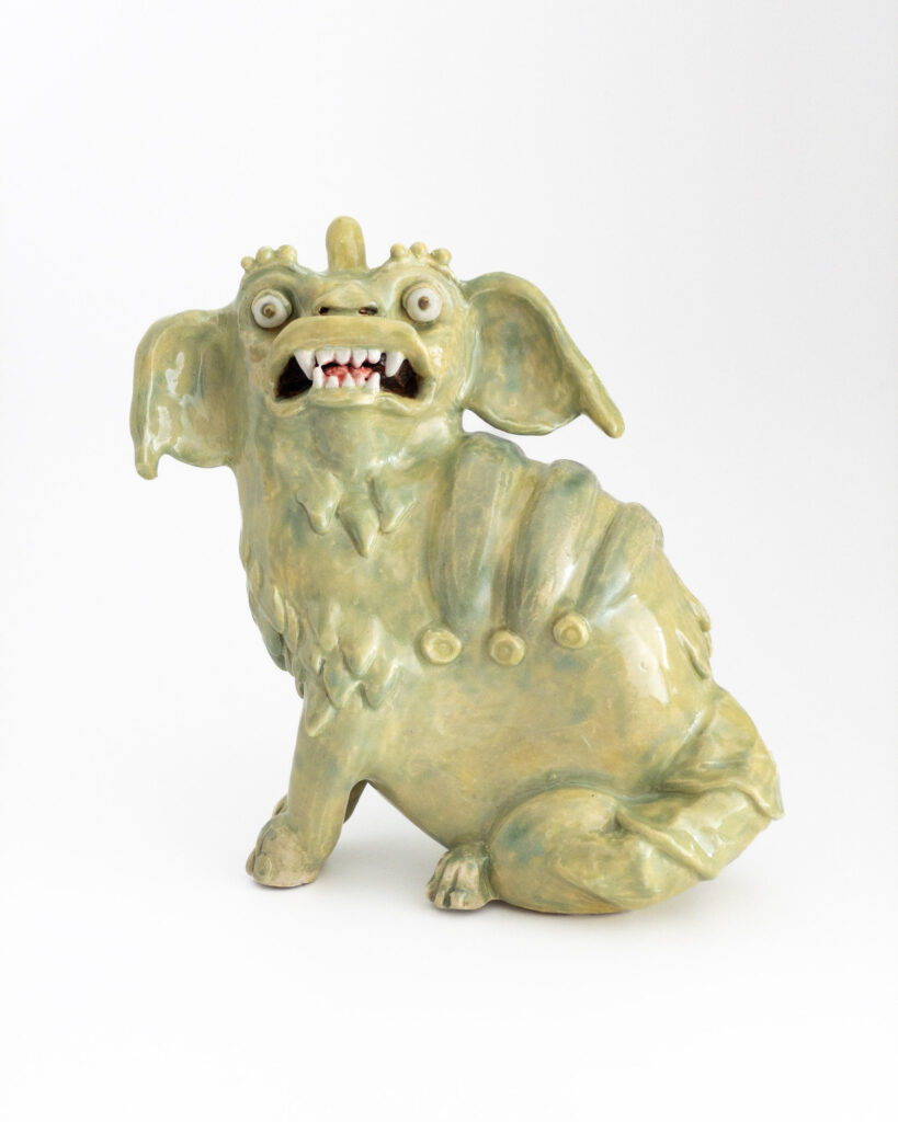 Ceramic sculpture based on Chinese-style dogs or lions in the Brighton pavilion, with green glaze