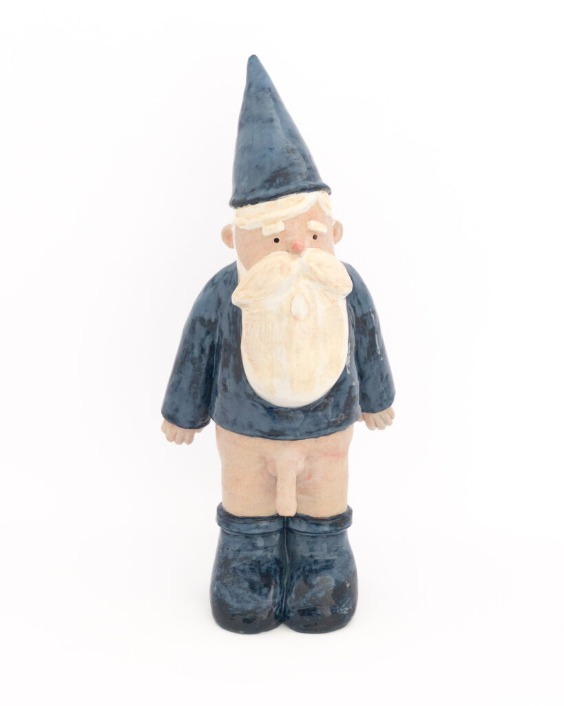 Ceramic gnome wearing blue hat, shirt and boots, but no trousers