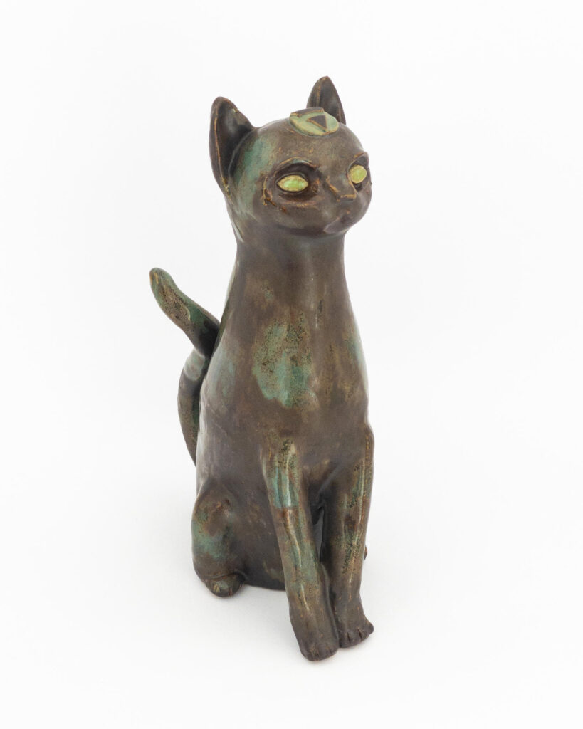 Ceramic sculpture of a cat representing earth with metallic green and matte brown glazes
