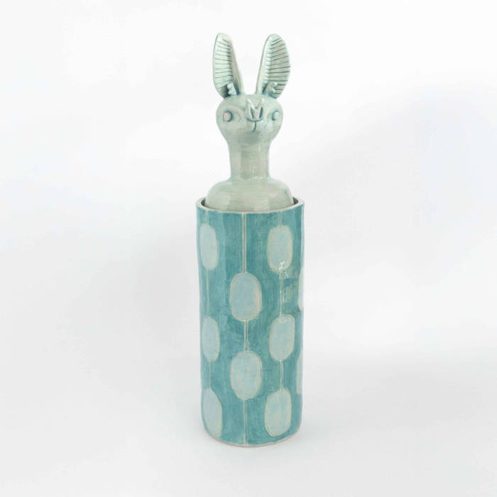 Cylindrical ceramic jar with a lid in the form of a blue bat head