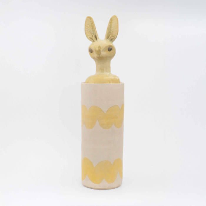 Cylindrical ceramic jar with a lid in the form of a yellow bat head