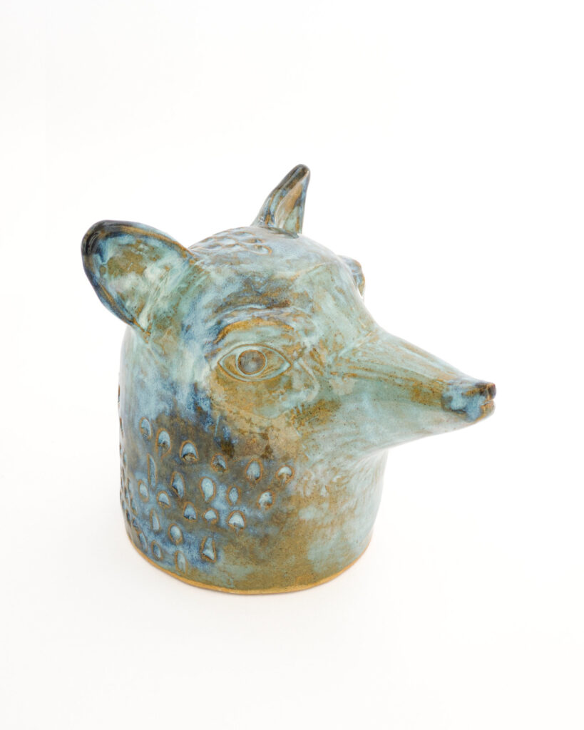 Fox head in textured blue and brown glazes, from the side