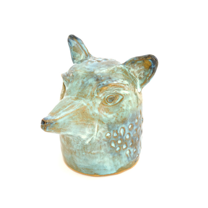 Ceramic sculpture of a fox head in textured blue glaze and with stamped patterns