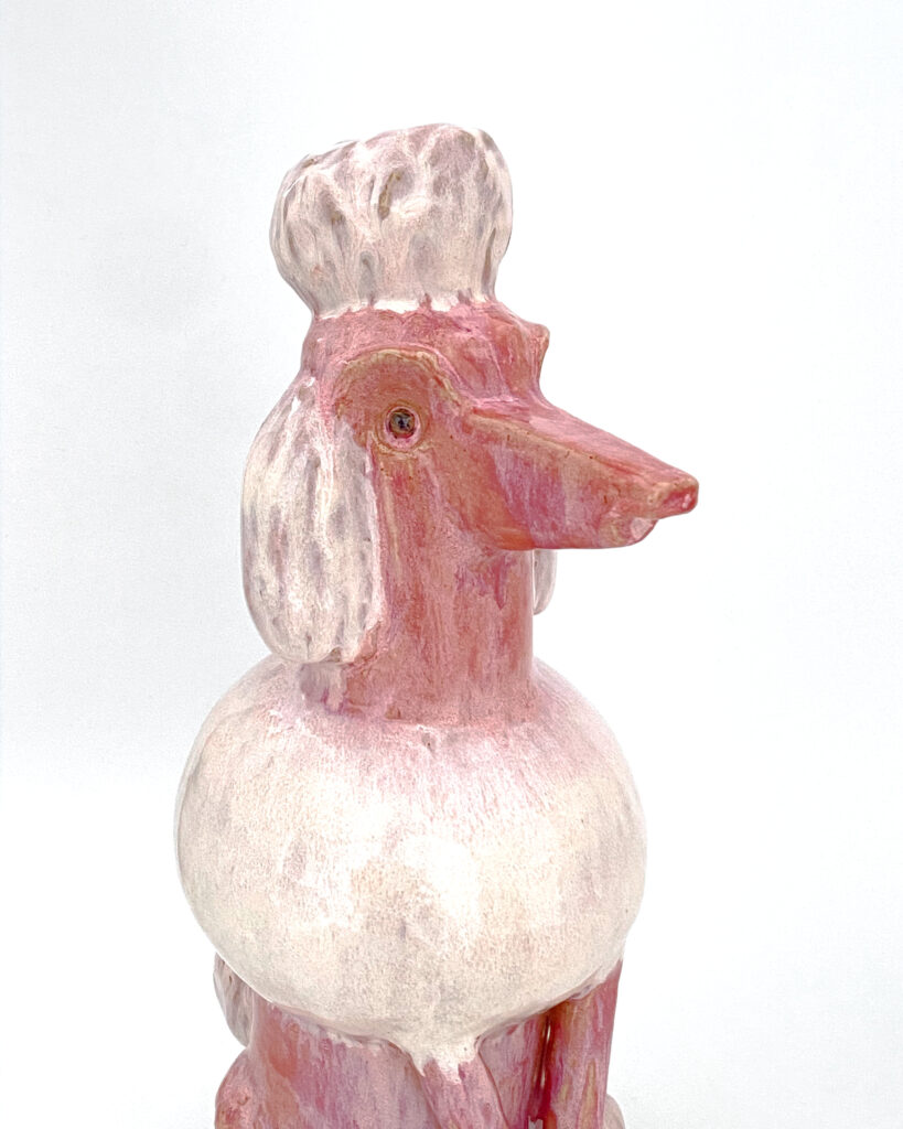 Poodle in mottled pink glaze, detail of the face 